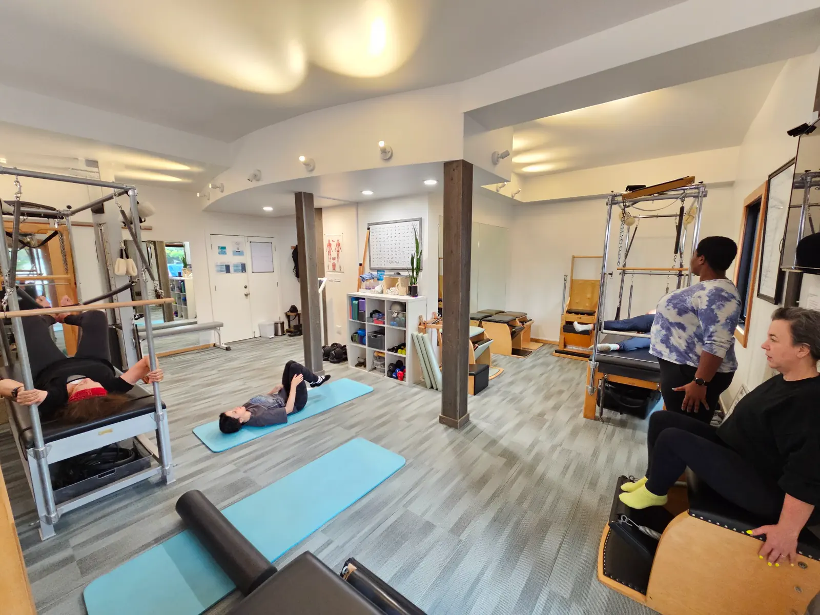 Pilates students learning together during a studio seminar