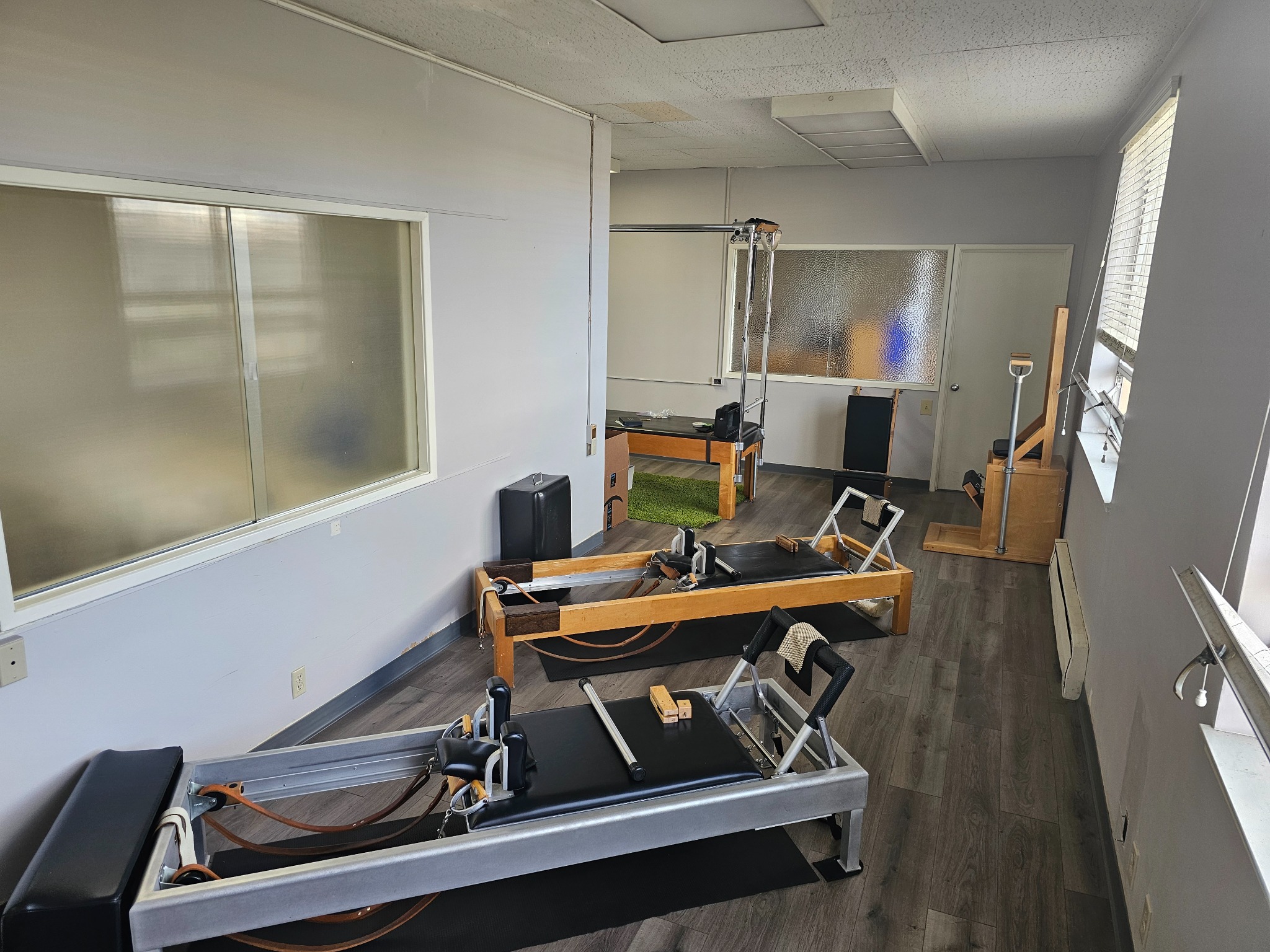 Classical Pilates reformers and equipment inside the Geary School training studio
