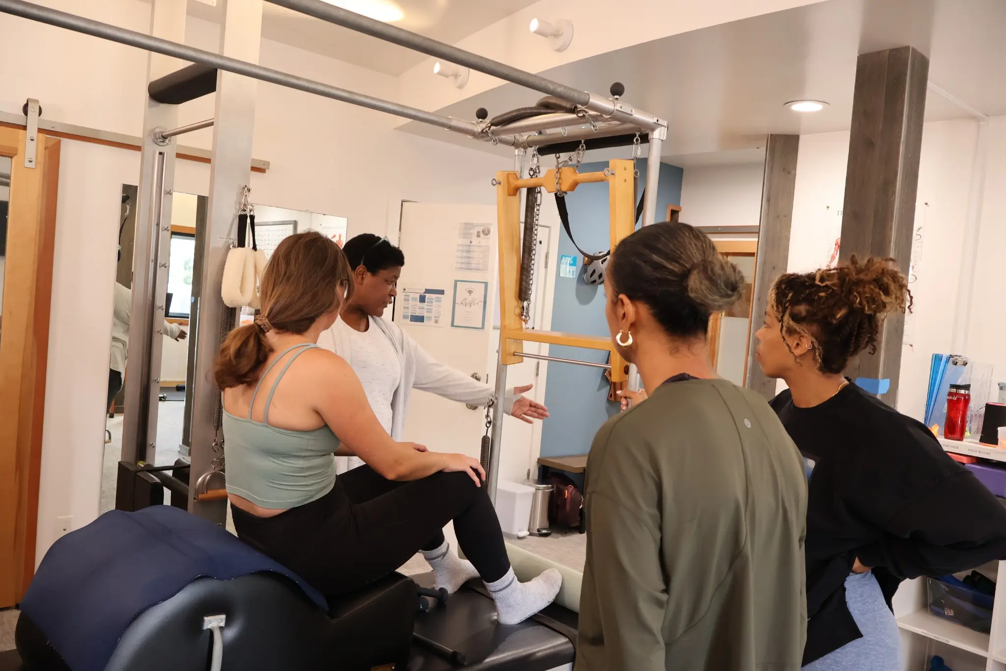 Teacher certification students learning hands-on Classical Pilates equipment work at the Geary School
